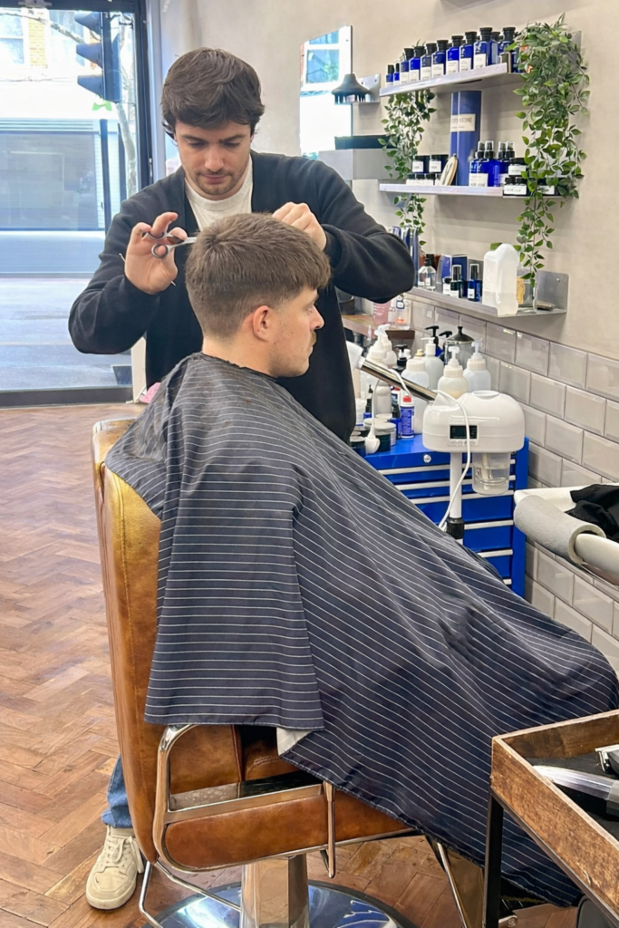 Barber focusing on a haircut
